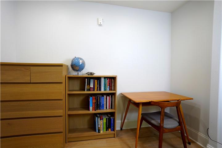 Work area with desk and bookshelf